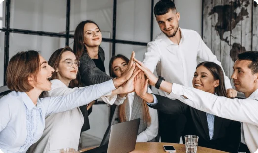 A team of working professionals celebrating success