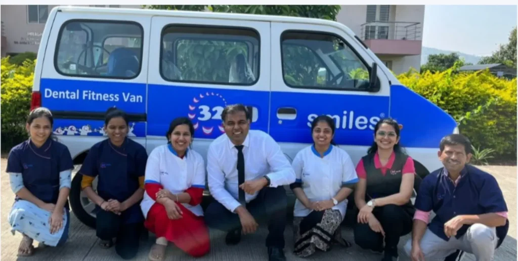 team of 32smiles with dental fitness van