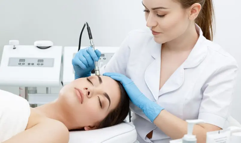 a dermatologist treating her patient