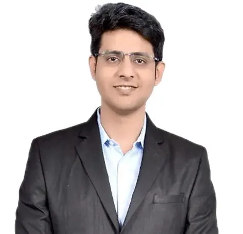Dr. Sameer Lote in a formal setting, smiling in a professional portrait