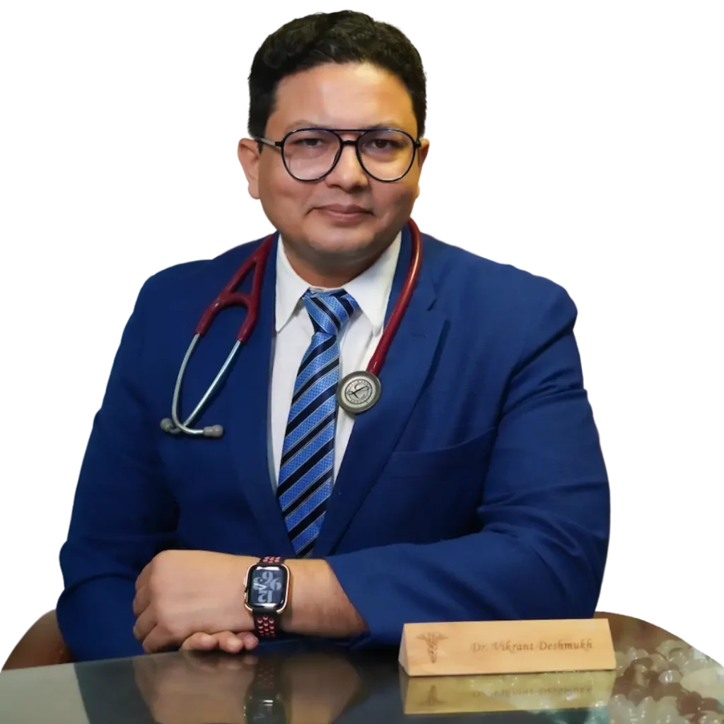 Dr. Vikrant Deshmukh, a pulmonologist, dressed in a blue suit and stethoscope, posing in a clinic setting