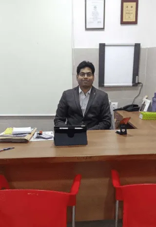 Doctor at Office Table – Physician in Personal Cabin