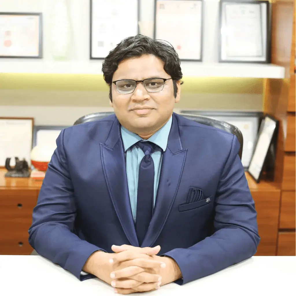 male doctor in formal suit sitting in clinic office with certificates background