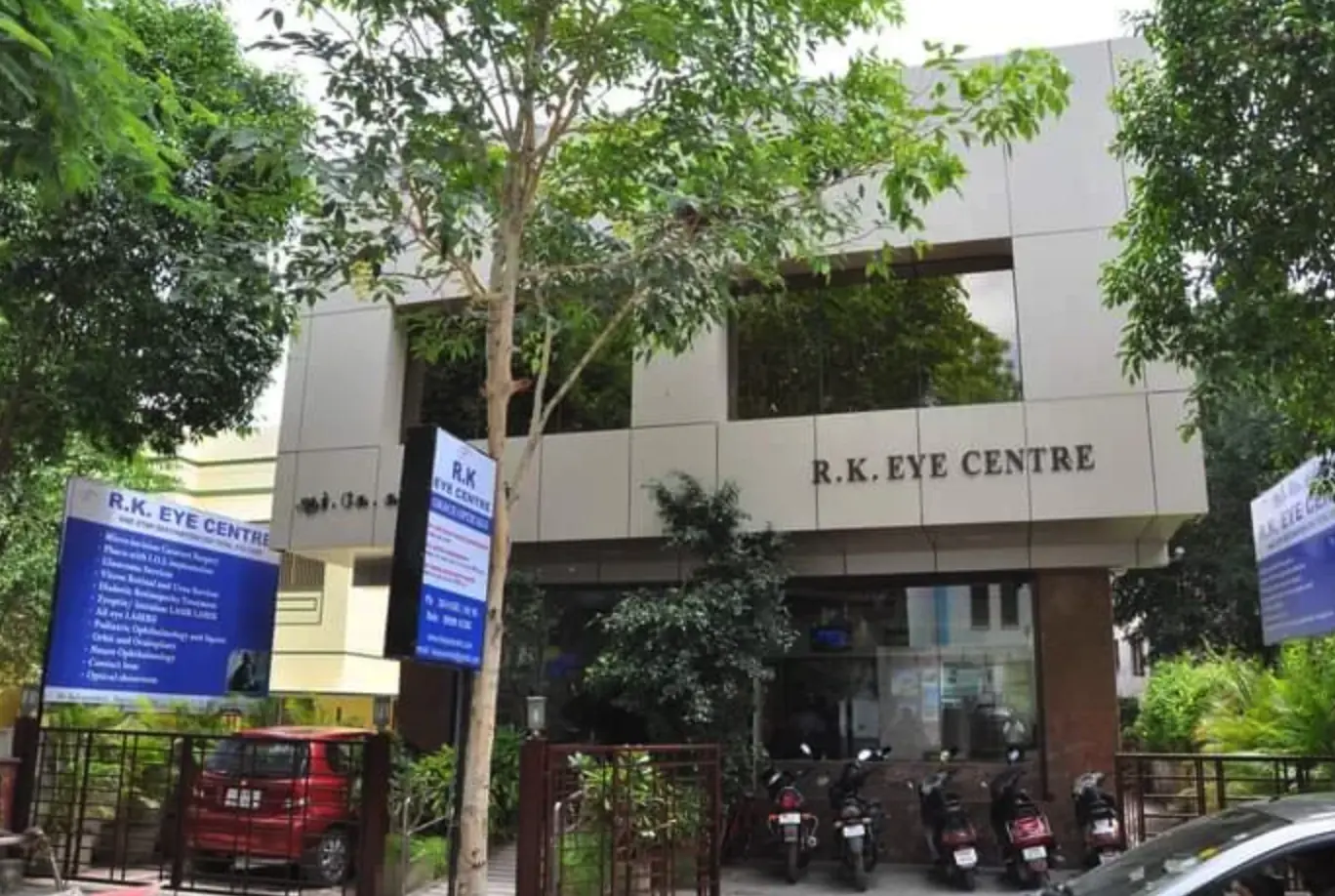 R.K. Eye Centre building exterior with signage and surrounding greenery