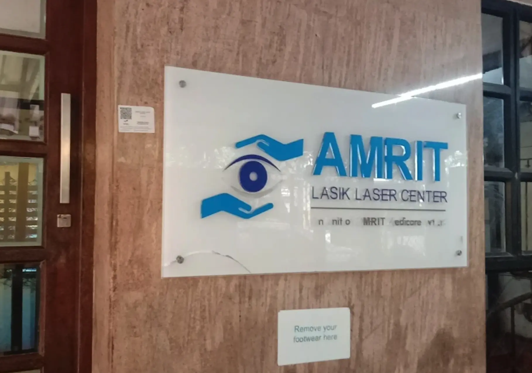 Amrit Eye Center interior signboard with eye care logo and branding