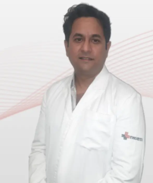 Dr. Anurag Verma, GI and bariatric surgeon, in a white doctor's coat